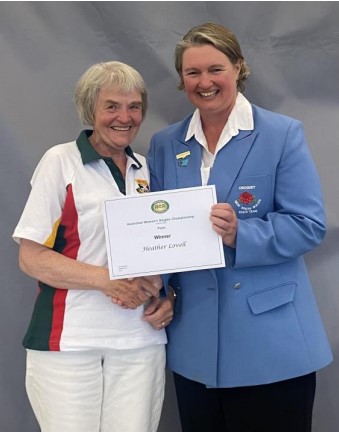 Heather Lovell, winner of the Association Women’s Singles Plate Event receiving her Trophy from ACA Board Member Kerri Ann Organ